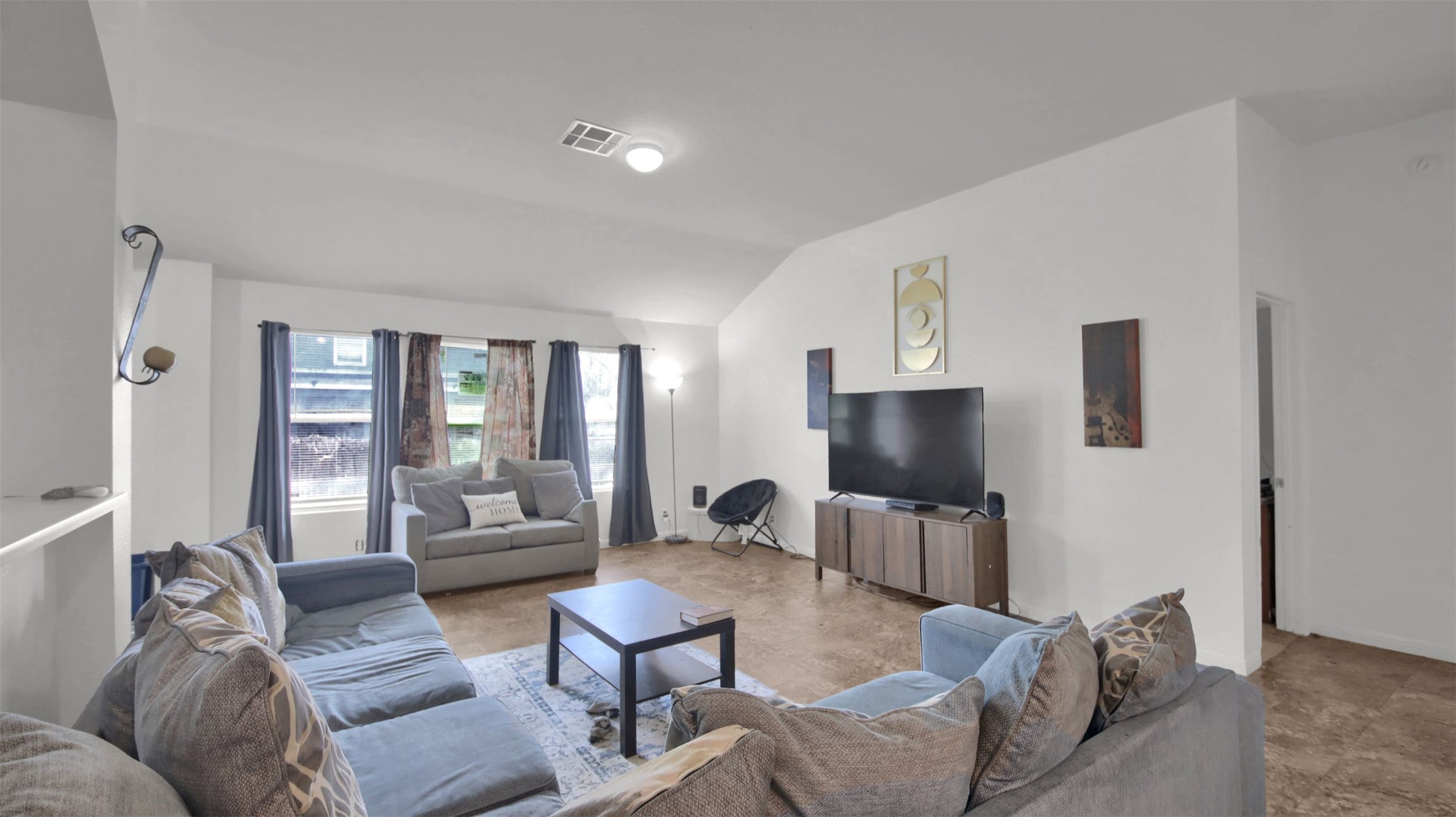 9609 Magna Carta Loop Austin, TX 78754 - Photo 8 of 30 a living room with furniture and a flat screen tv