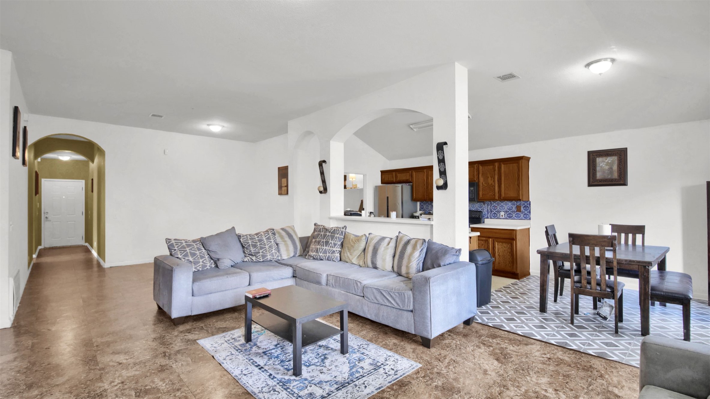 9609 Magna Carta Loop Austin, TX 78754 - Photo 9 of 30 a living room with furniture potted plant and kitchen view