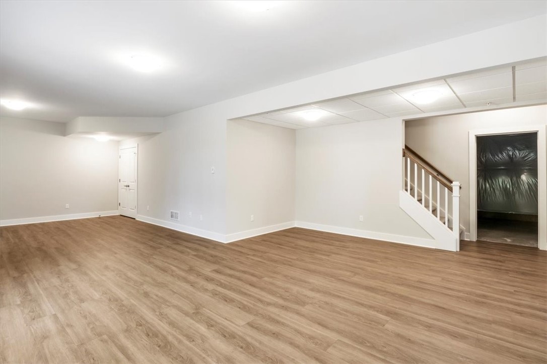 57 Coventry Ridge Pittsford, NY 14534 - Photo 30 of 37 Finished terrace level with LVP flooring in rec ro