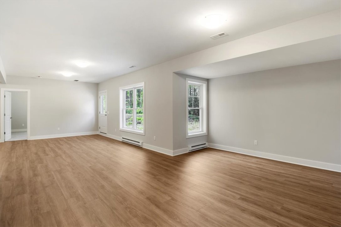 57 Coventry Ridge Pittsford, NY 14534 - Photo 32 of 37 Finished terrace level with LVP flooring in rec ro