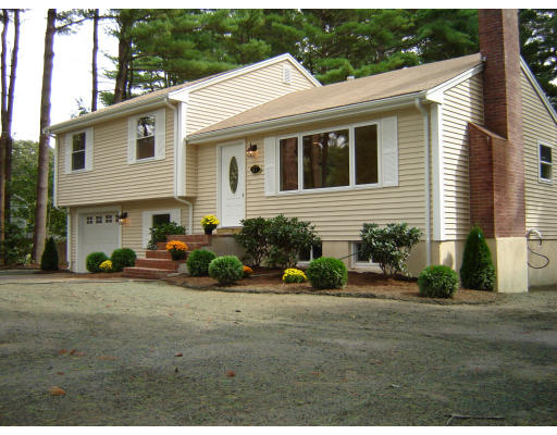 47 Pinetree Road Stoughton, MA 02072 - Photo 1 of 4 a front view of a house with a yard