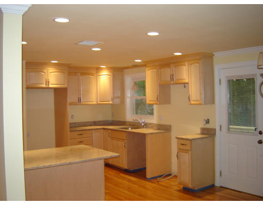 47 Pinetree Road Stoughton, MA 02072 - Photo 2 of 4 a kitchen with stainless steel appliances granite countertop a sink and cabinets