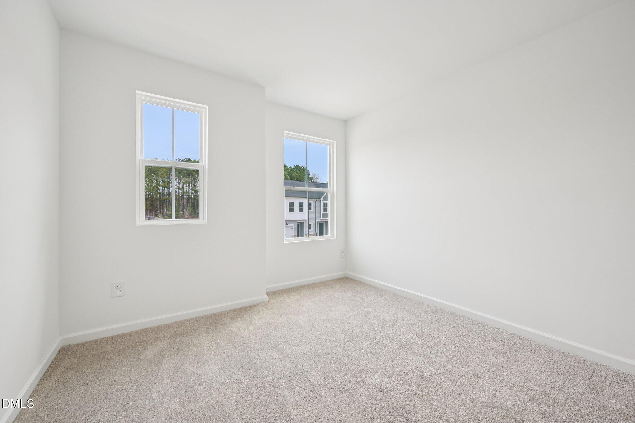 1610 Mirth Court Rolesville, NC 27571 - Photo 20 of 36 an empty room with windows