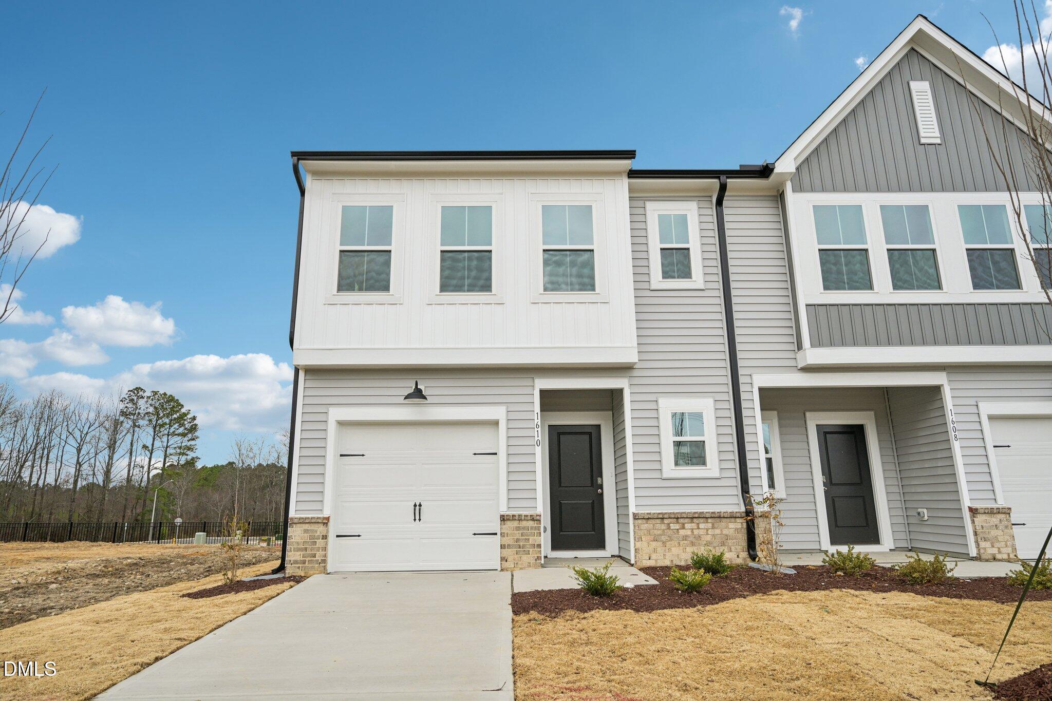 1610 Mirth Court Rolesville, NC 27571 - Photo 2 of 36 a front view of a house with a yard