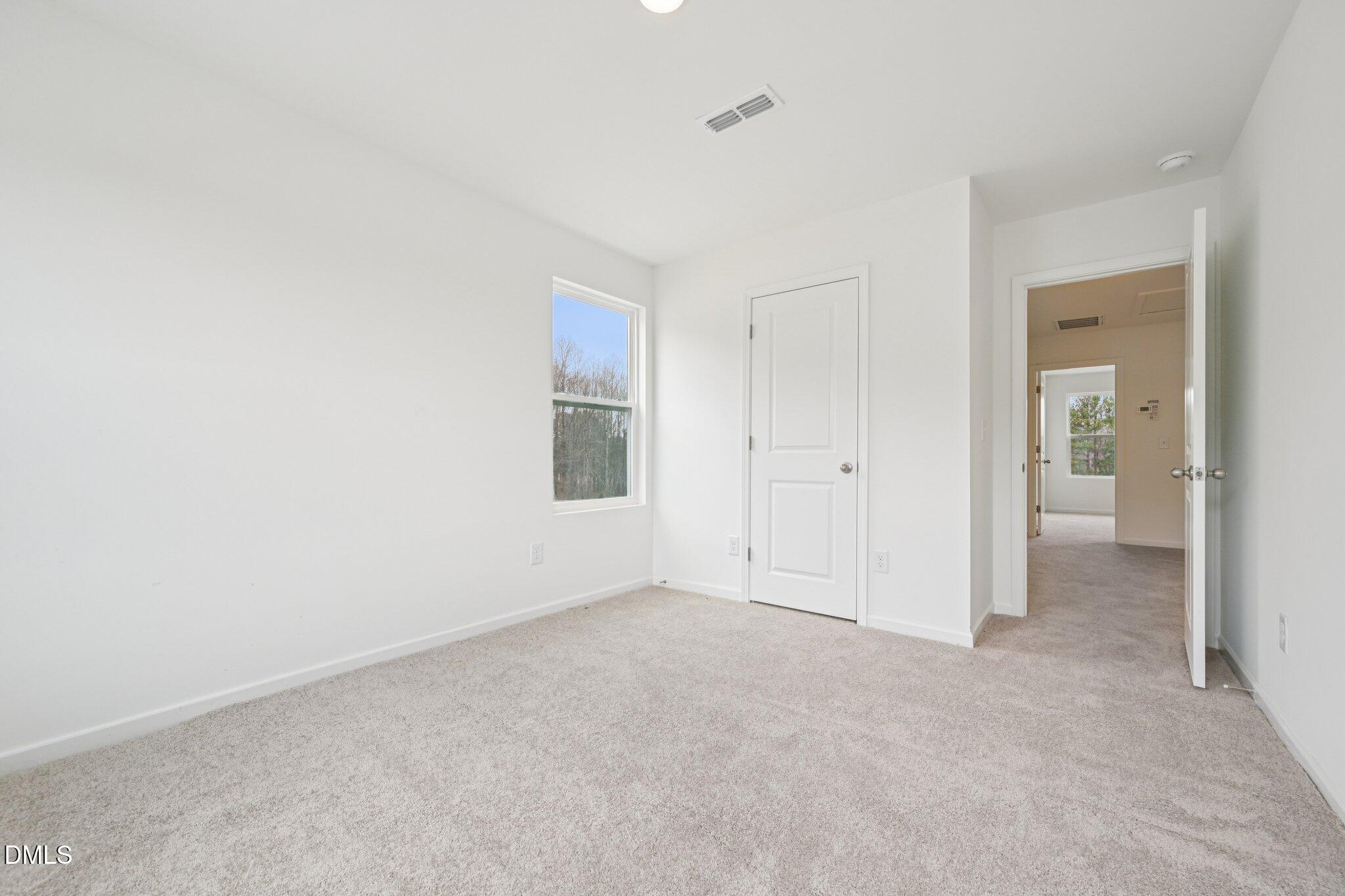 1610 Mirth Court Rolesville, NC 27571 - Photo 22 of 36 an empty room with a bathroom and mirror