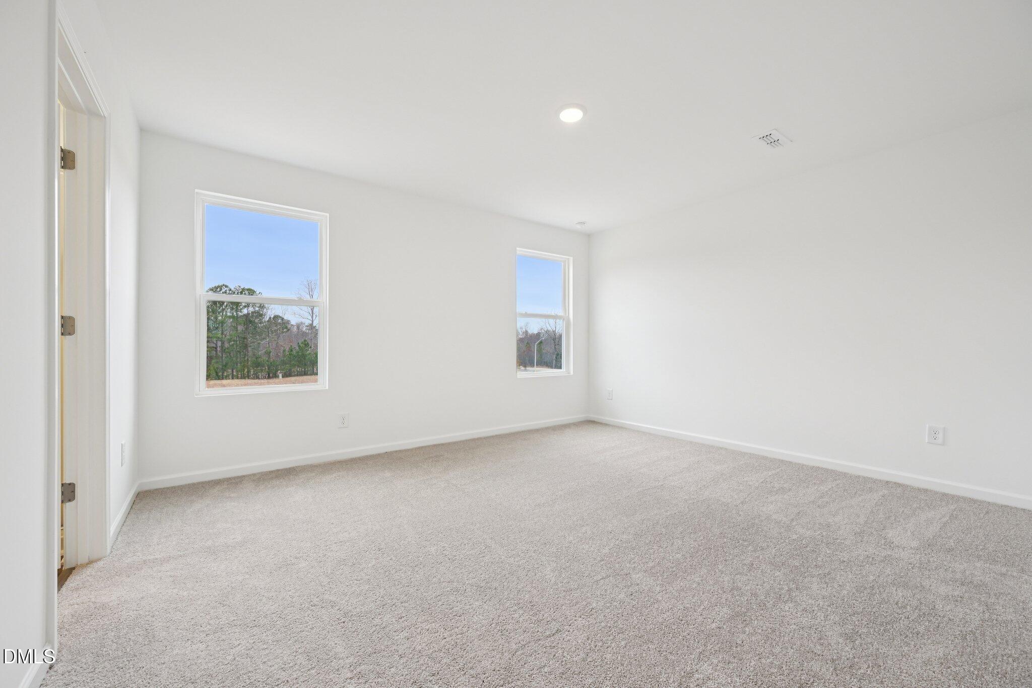 1610 Mirth Court Rolesville, NC 27571 - Photo 23 of 36 a view of an empty room with a window