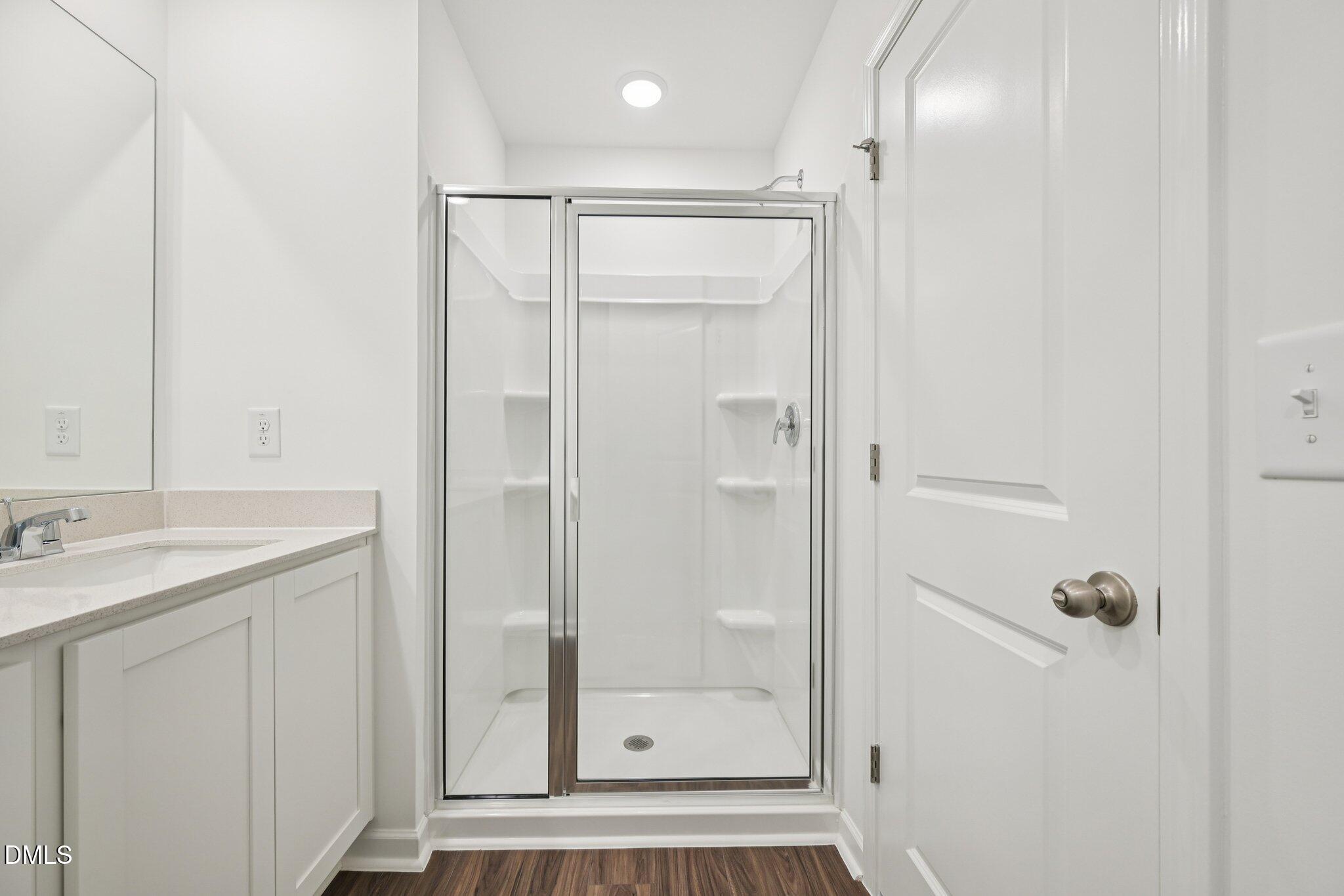 1610 Mirth Court Rolesville, NC 27571 - Photo 26 of 36 a bathroom with a shower and a sink