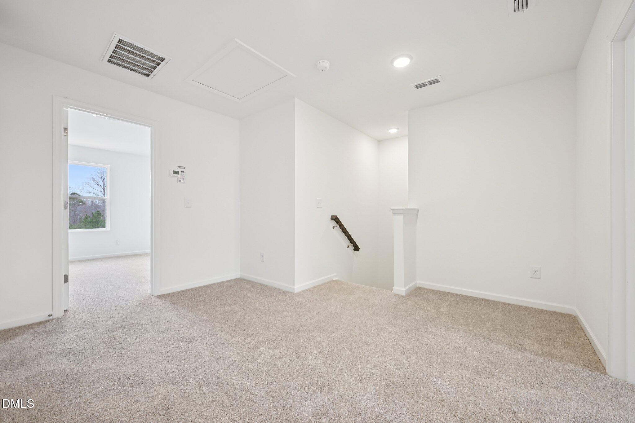 1610 Mirth Court Rolesville, NC 27571 - Photo 28 of 36 an empty room with an entryway