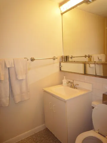 a bathroom with a sink and mirror