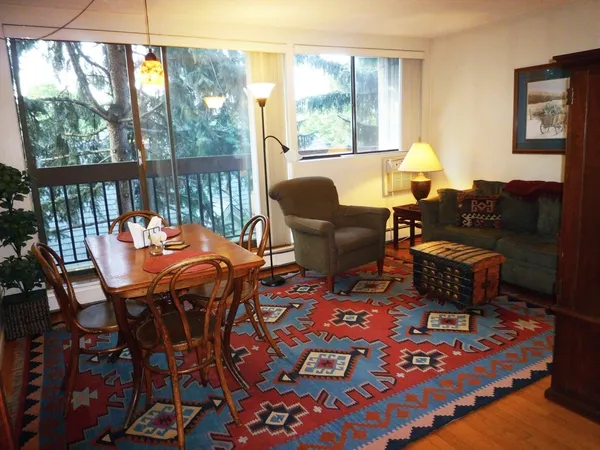 a outdoor living space with furniture and a rug