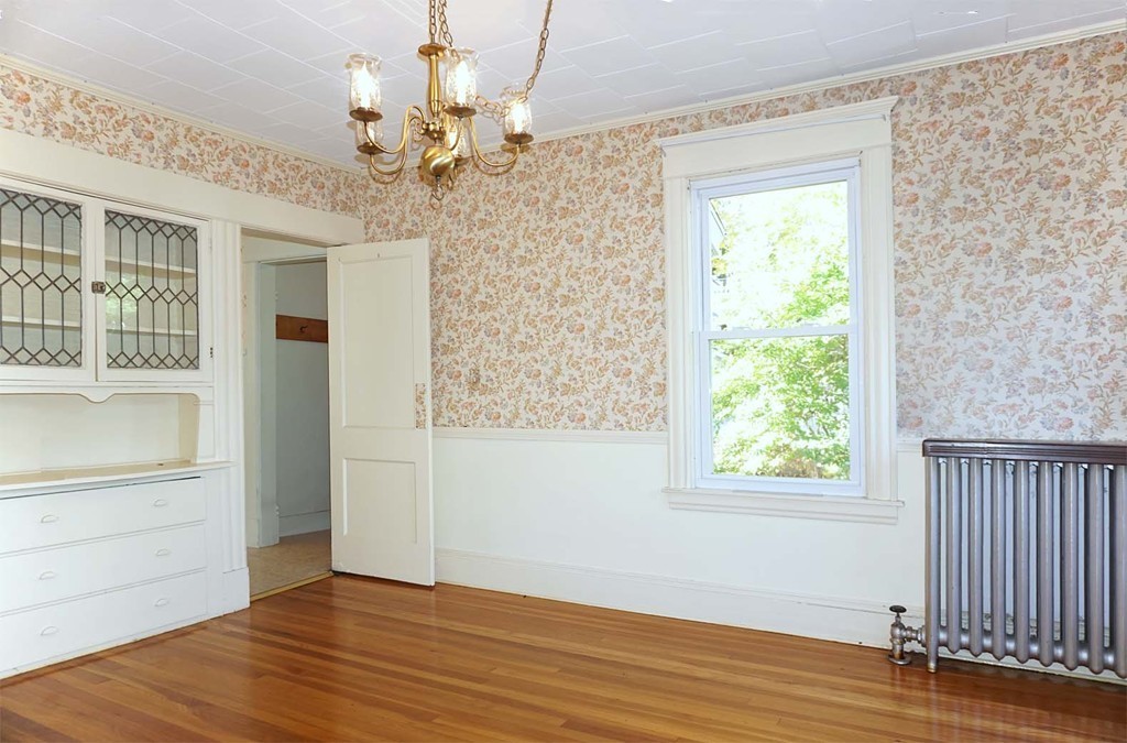 44 Herman Street Springfield, MA 01108 - Photo 9 of 26 a view of a livingroom with wooden floor and a chandelier