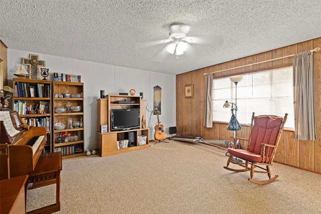 a kitchen with stainless steel appliances granite countertop a refrigerator a stove and a sink