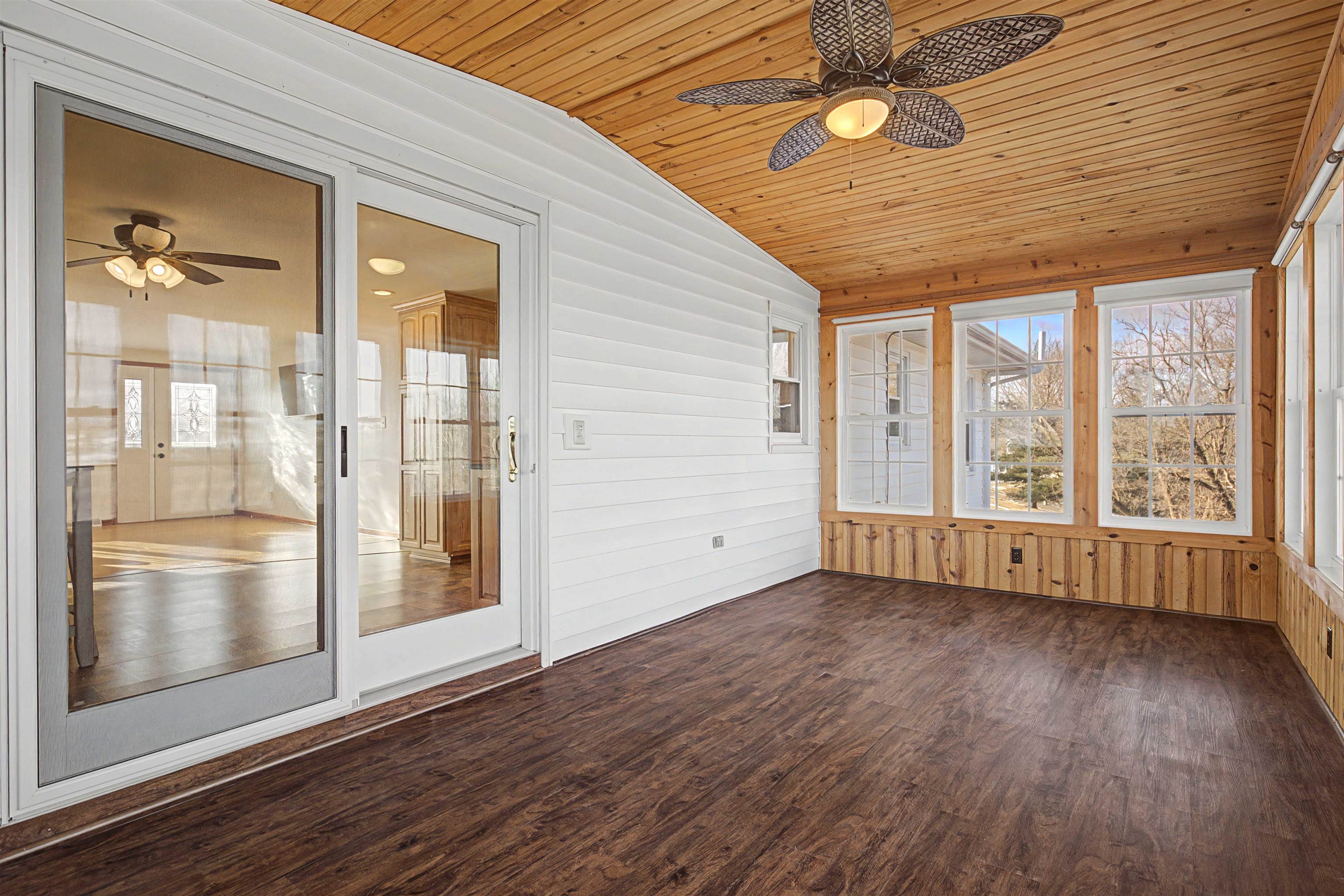 325 Apache Court Galena, IL 61036 - Photo 18 of 43 an empty room with wooden floor and windows