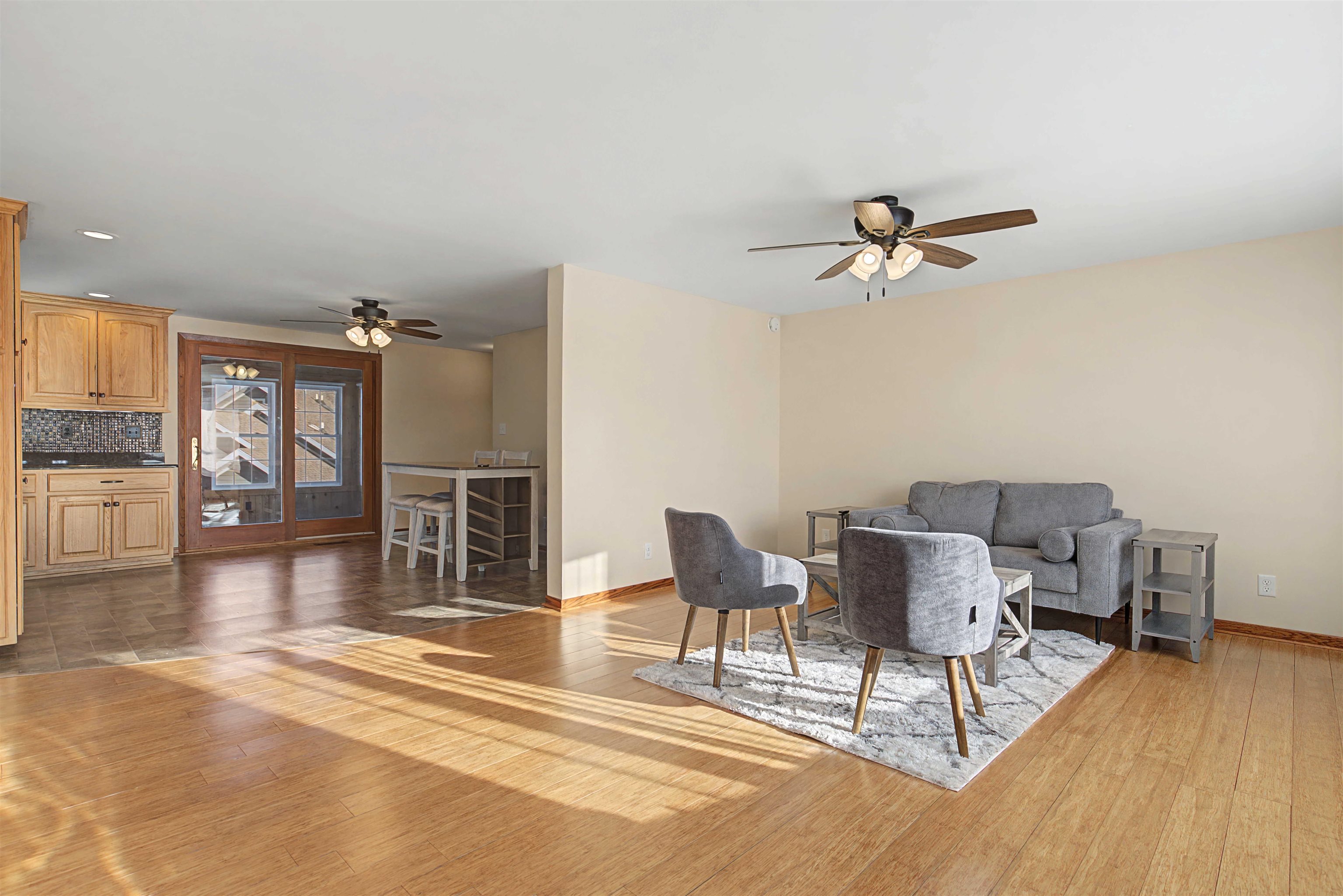 325 Apache Court Galena, IL 61036 - Photo 2 of 43 a view of a livingroom with furniture wooden floor and a ceiling fan