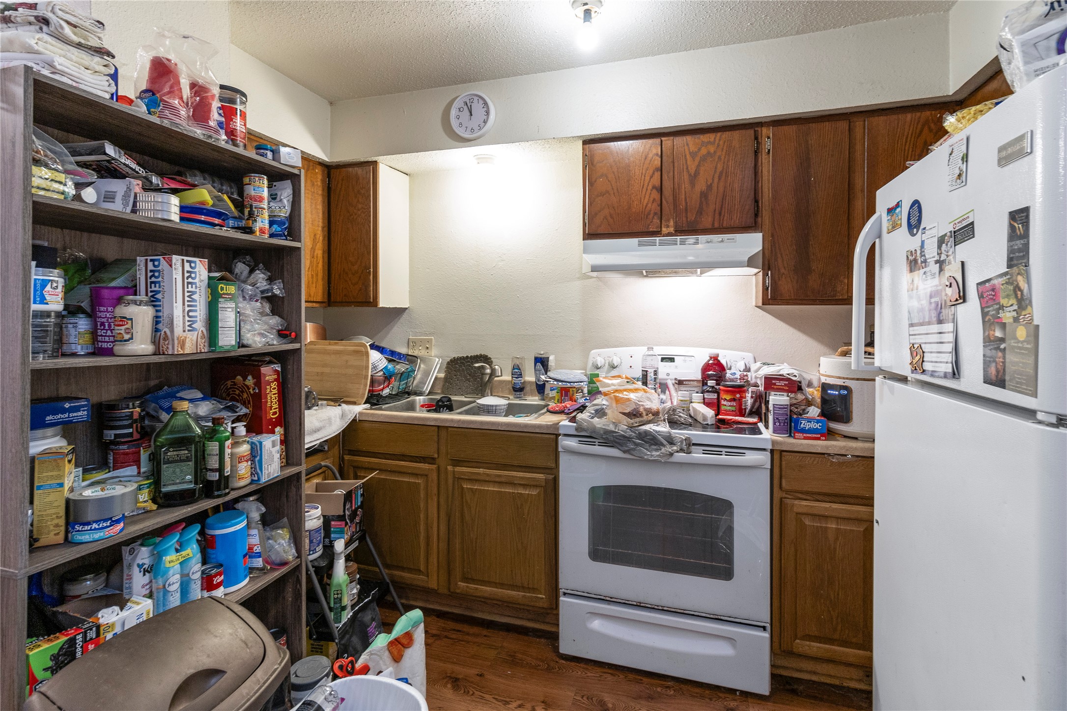 4121 Old Hearne Road Bryan, TX 77803 - Photo 14 of 14 a kitchen with stainless steel appliances granite countertop a stove and cabinets