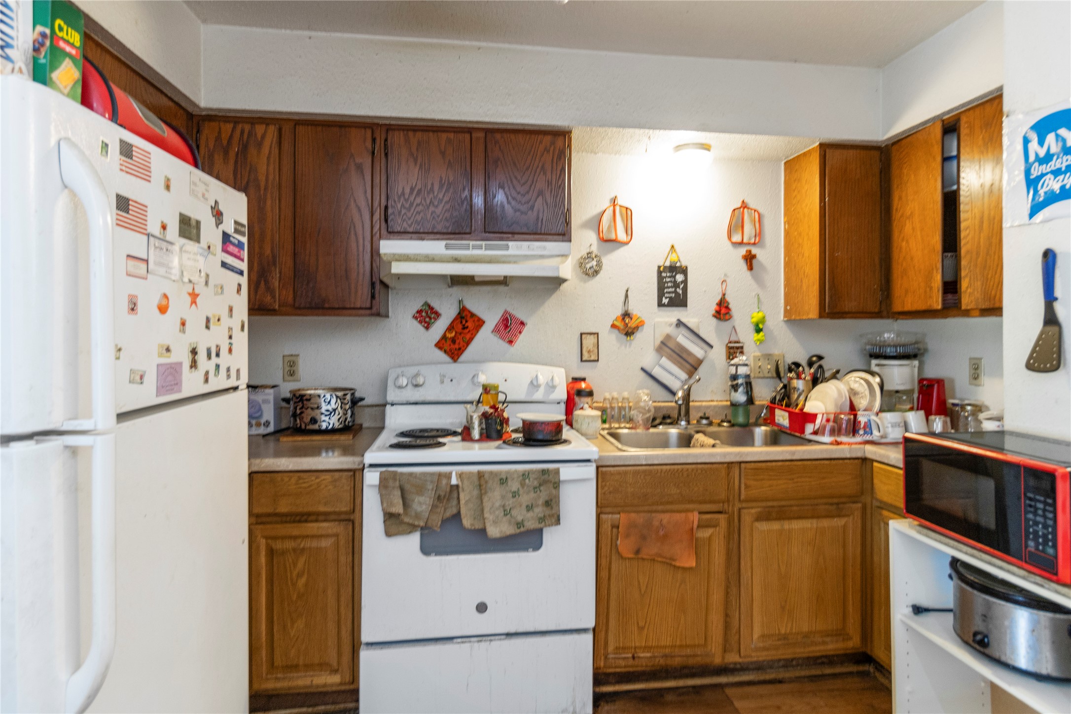 4121 Old Hearne Road Bryan, TX 77803 - Photo 3 of 14 a view of a kitchen with fridge and workspace