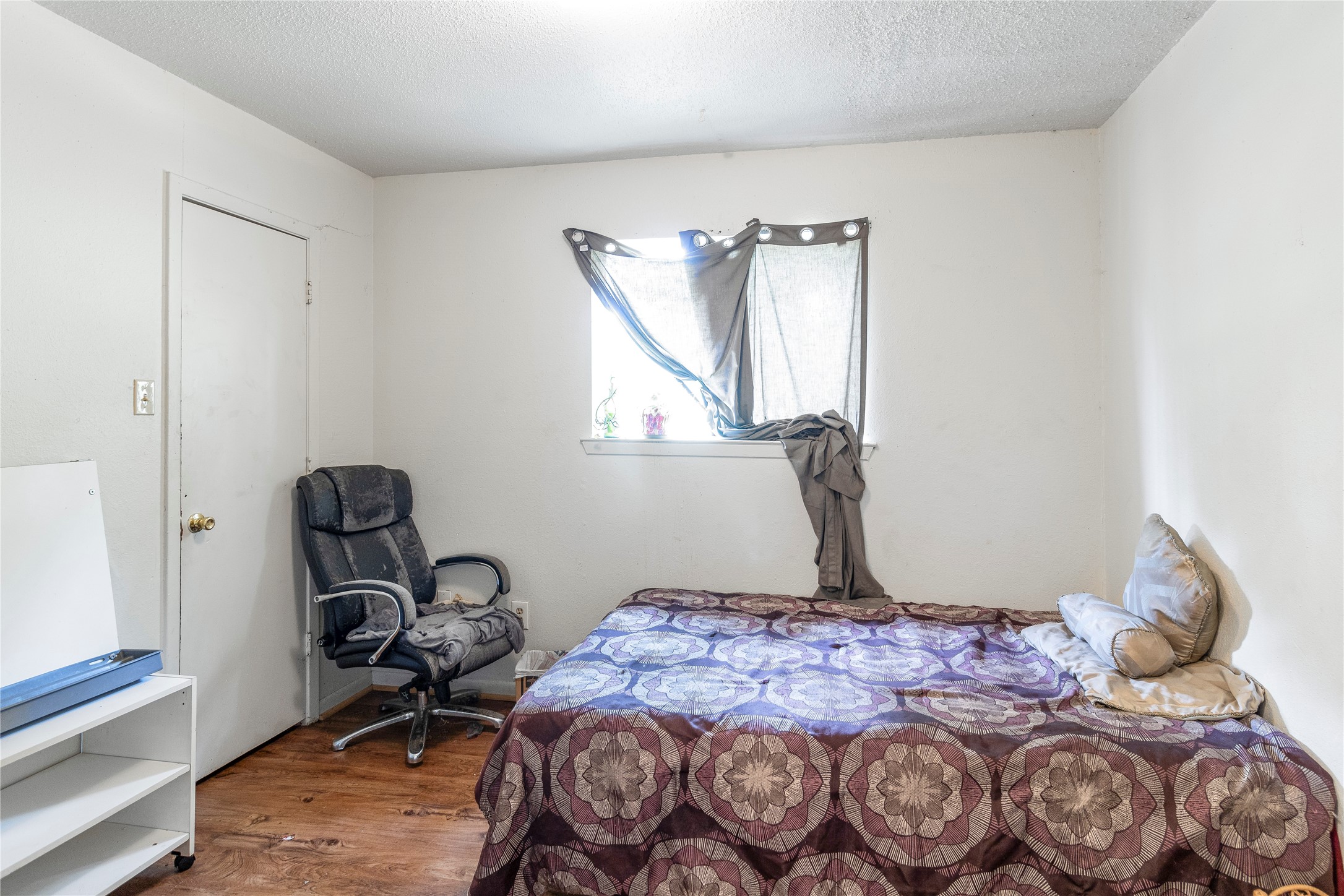 4121 Old Hearne Road Bryan, TX 77803 - Photo 5 of 14 a bedroom with a bed and a window