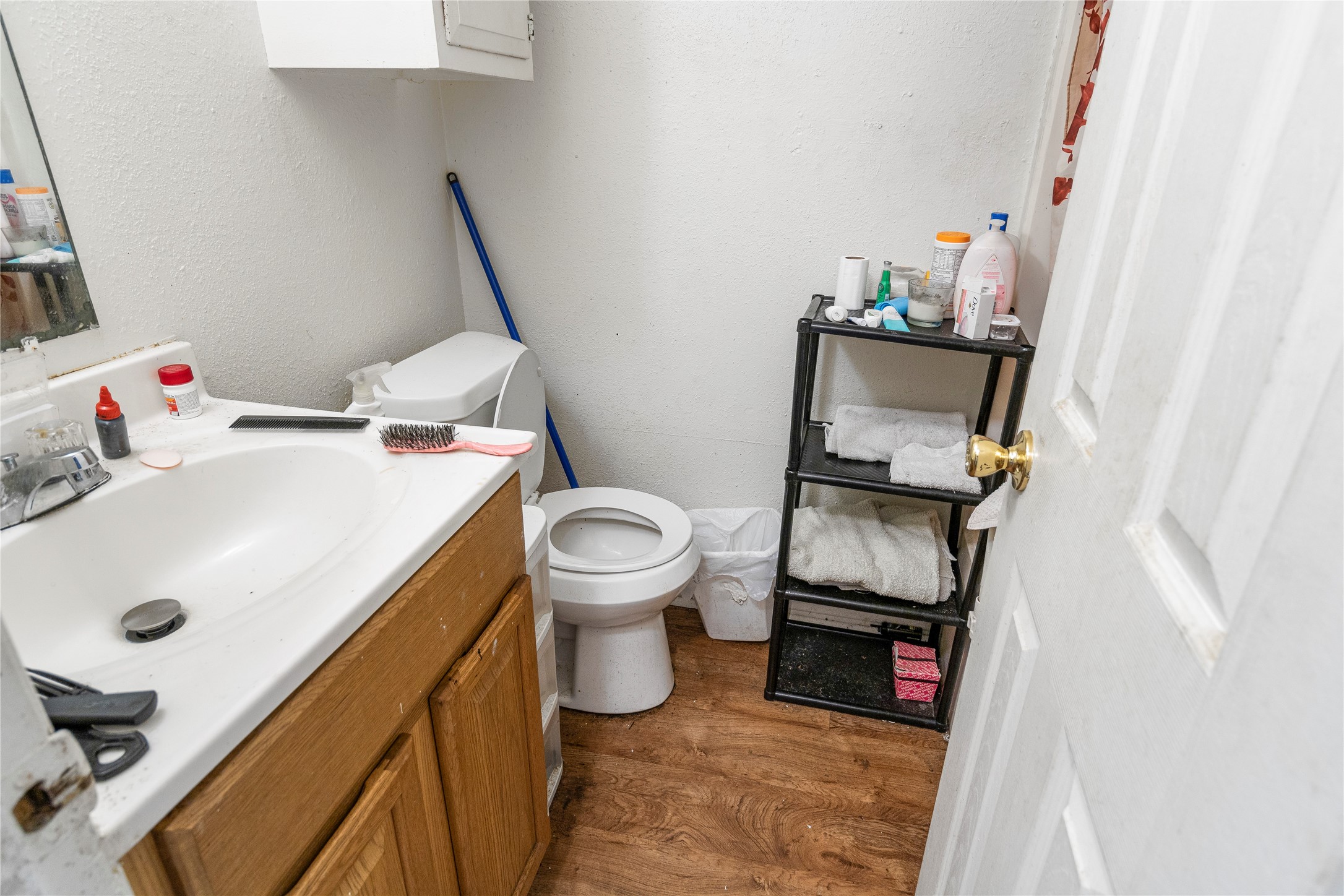 4121 Old Hearne Road Bryan, TX 77803 - Photo 7 of 14 a bathroom with a sink toilet and mirror