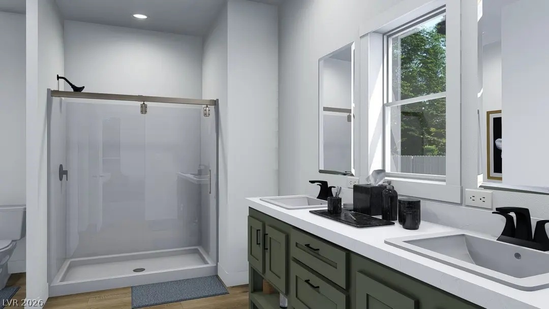 466 Box Canyon Road Alamo, NV 89001 - Photo 6 of 9 Clean lines and a double vanity define this modern bathroom space.