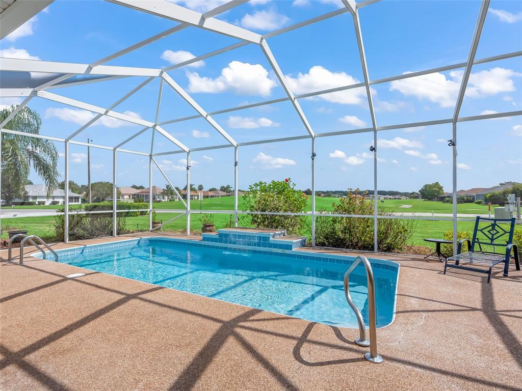 17786 Southeast 119th Avenue Road Summerfield, FL 34491 - Photo 13 of 43 a view of a swimming pool with a patio