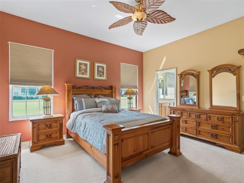 17786 Southeast 119th Avenue Road Summerfield, FL 34491 - Photo 20 of 43 a bedroom with a bed and a large window with the outer view