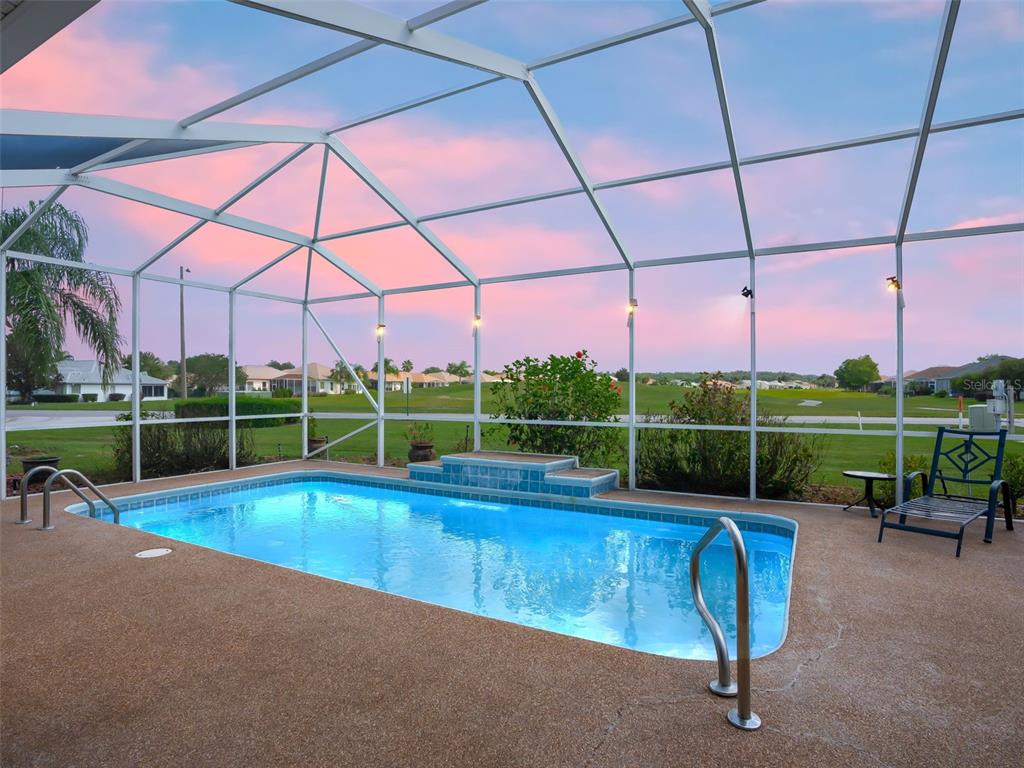 17786 Southeast 119th Avenue Road Summerfield, FL 34491 - Photo 2 of 43 a view of a swimming pool with a yard