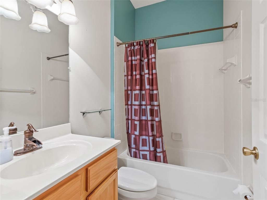 17786 Southeast 119th Avenue Road Summerfield, FL 34491 - Photo 27 of 43 a bathroom with a sink toilet and shower