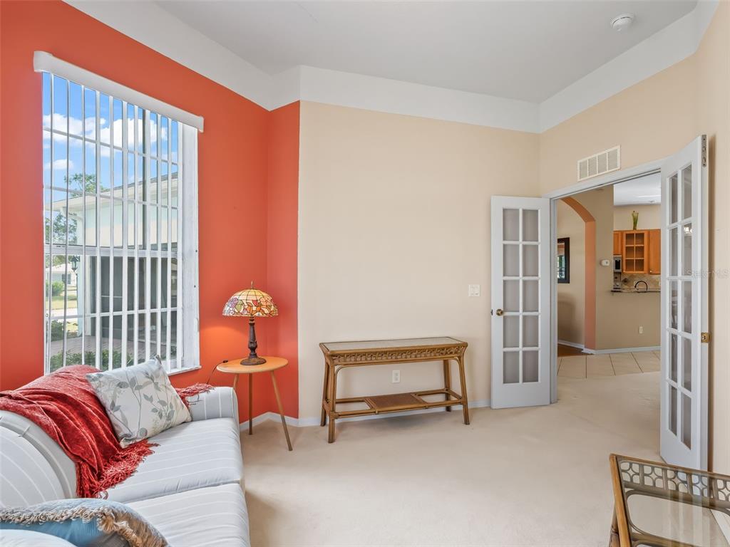 17786 Southeast 119th Avenue Road Summerfield, FL 34491 - Photo 29 of 43 a living room with furniture and a window