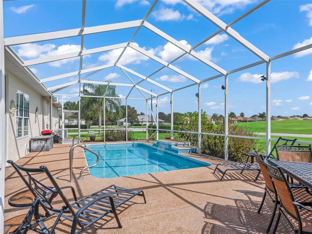17786 Southeast 119th Avenue Road Summerfield, FL 34491 - Photo 30 of 43 a view of a swimming pool with a patio