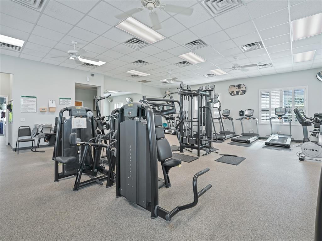 17786 Southeast 119th Avenue Road Summerfield, FL 34491 - Photo 40 of 43 a view of a room with gym equipment