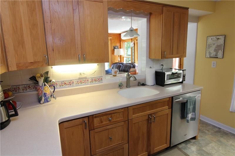 37 Forest Grove Road Coraopolis, PA 15108 - Photo 9 of 21 Lovely kitchen with cutout into the family room will make sure that you're always included in the conversation.