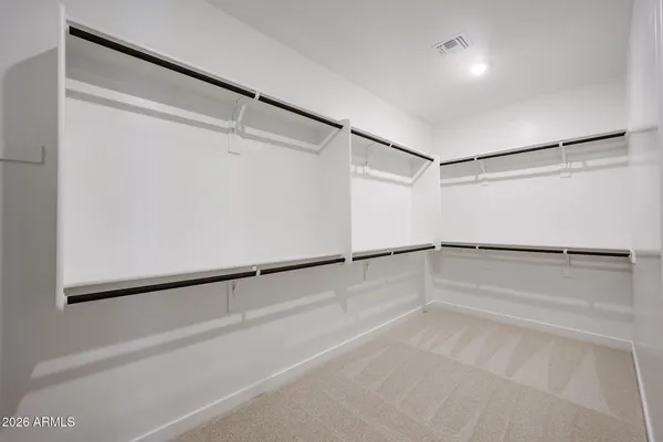 a view of a room with an empty walk in closet