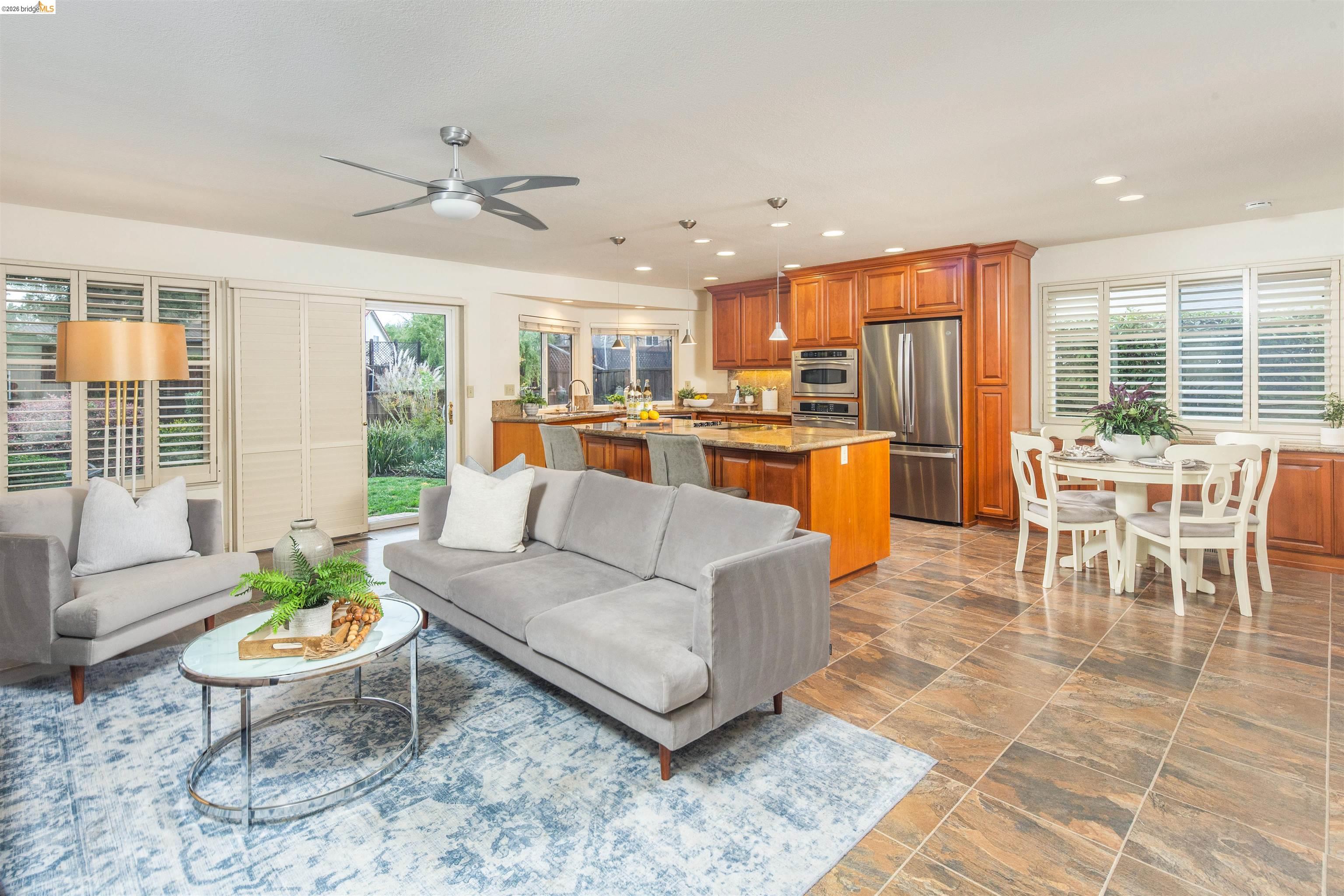 3237 Veracruz Drive San Ramon, CA 94583 - Photo 16 of 59 a living room with furniture dining table and a large window