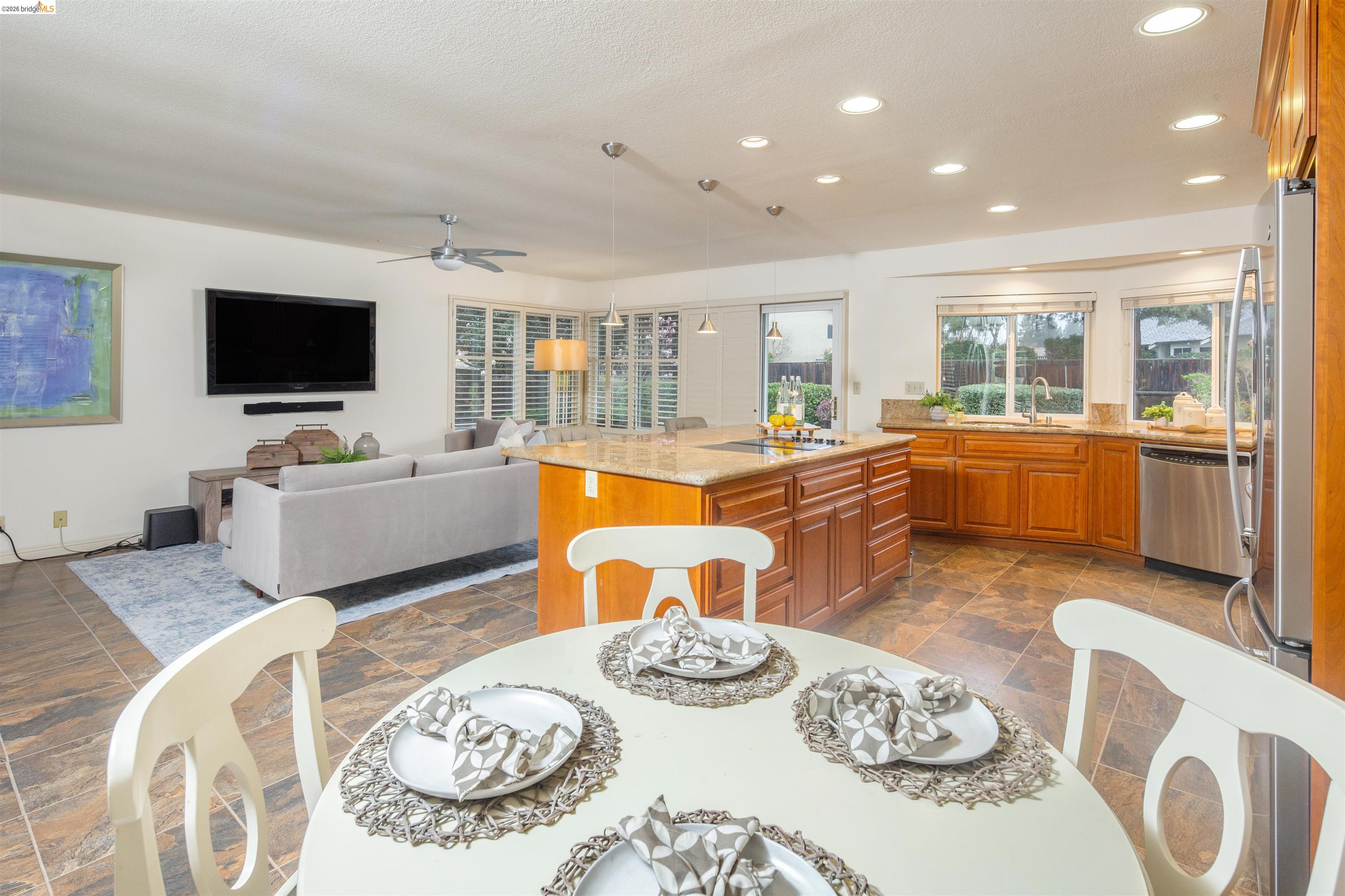 3237 Veracruz Drive San Ramon, CA 94583 - Photo 18 of 59 a living room with furniture a flat screen tv and a dining table