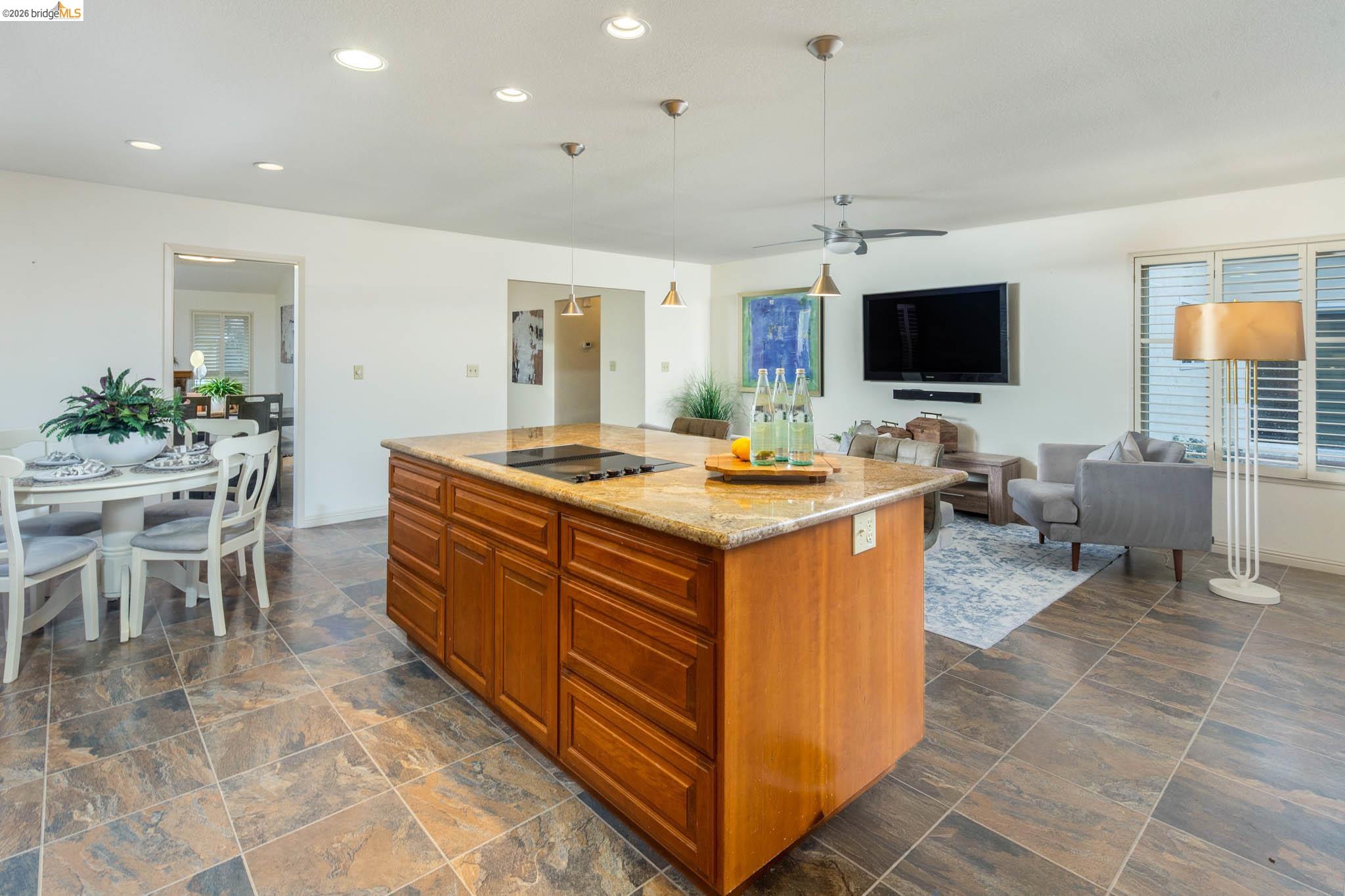 3237 Veracruz Drive San Ramon, CA 94583 - Photo 24 of 59 a room with furniture a flat screen tv and kitchen view