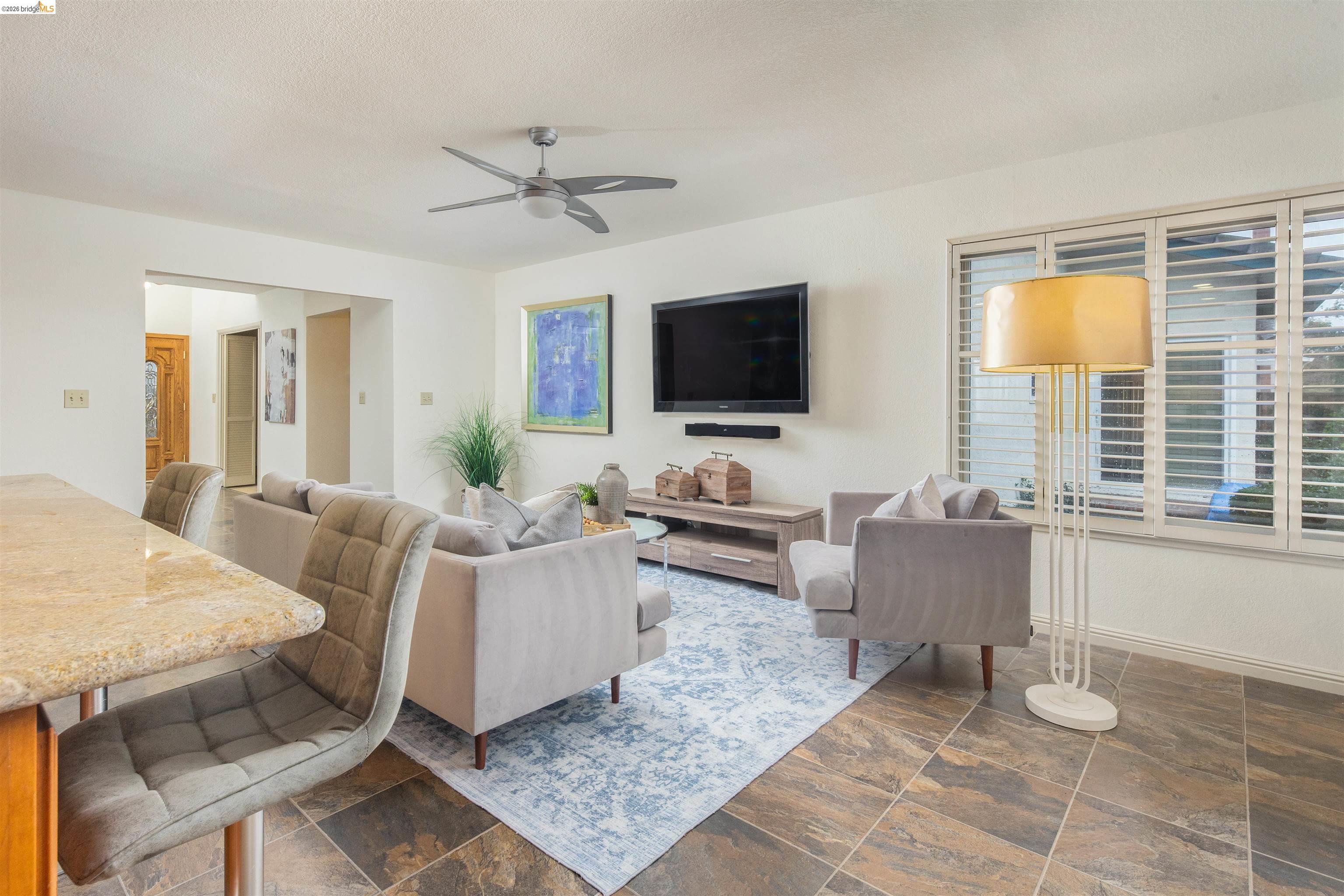 3237 Veracruz Drive San Ramon, CA 94583 - Photo 27 of 59 a living room with furniture and a flat screen tv