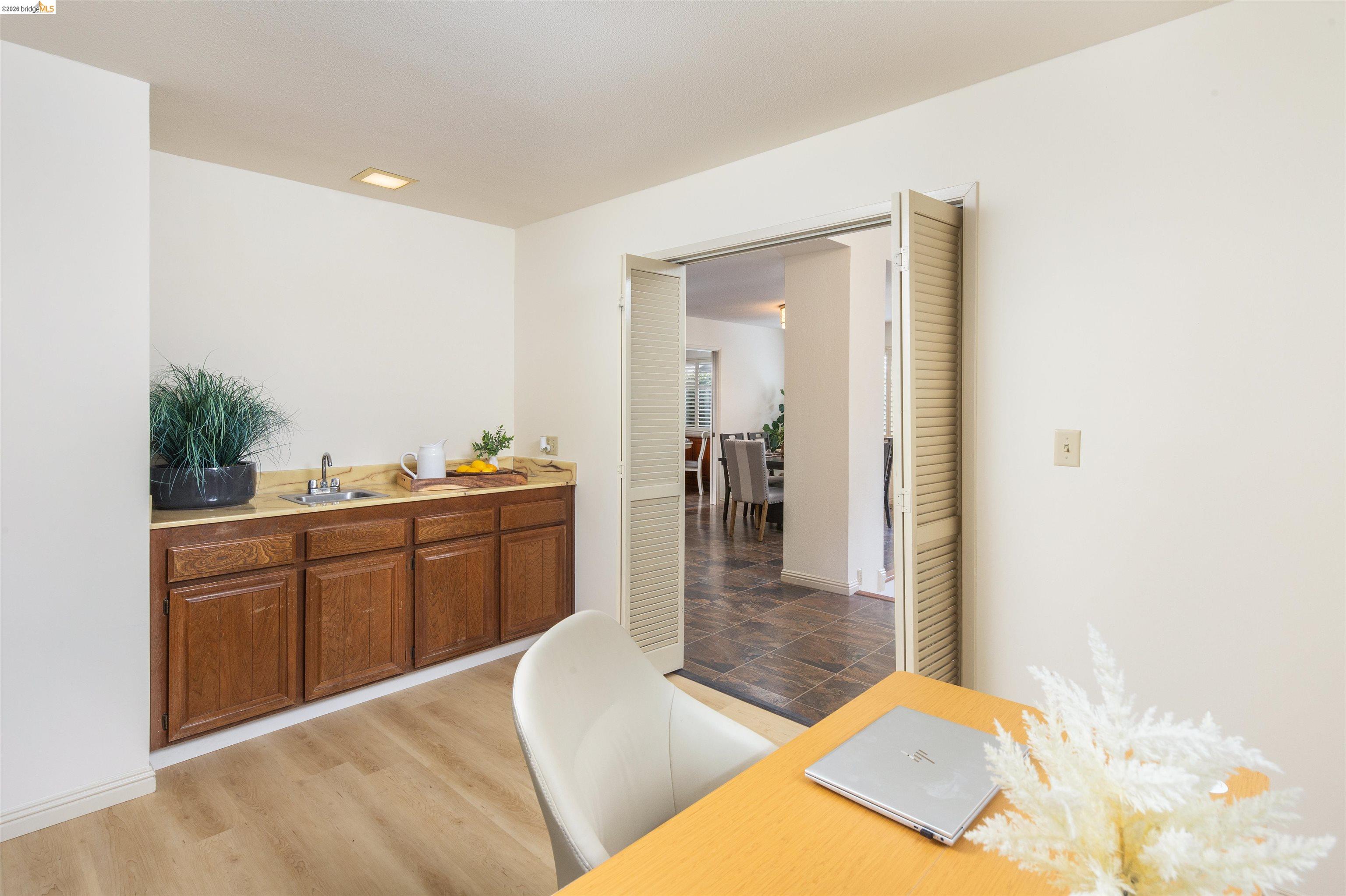 3237 Veracruz Drive San Ramon, CA 94583 - Photo 29 of 59 a living room with kitchen island furniture and a kitchen view