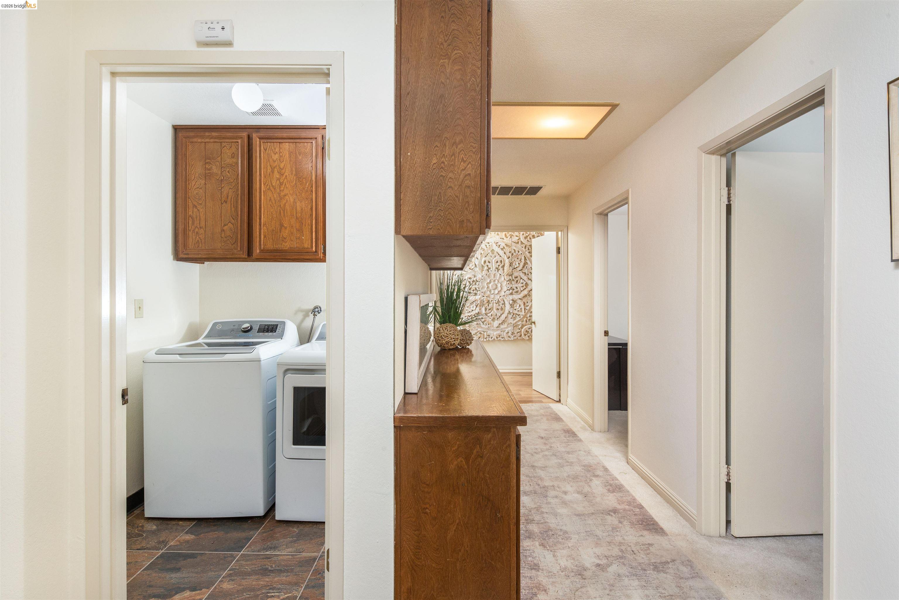 3237 Veracruz Drive San Ramon, CA 94583 - Photo 31 of 59 a view of a hallway with washer and dryer