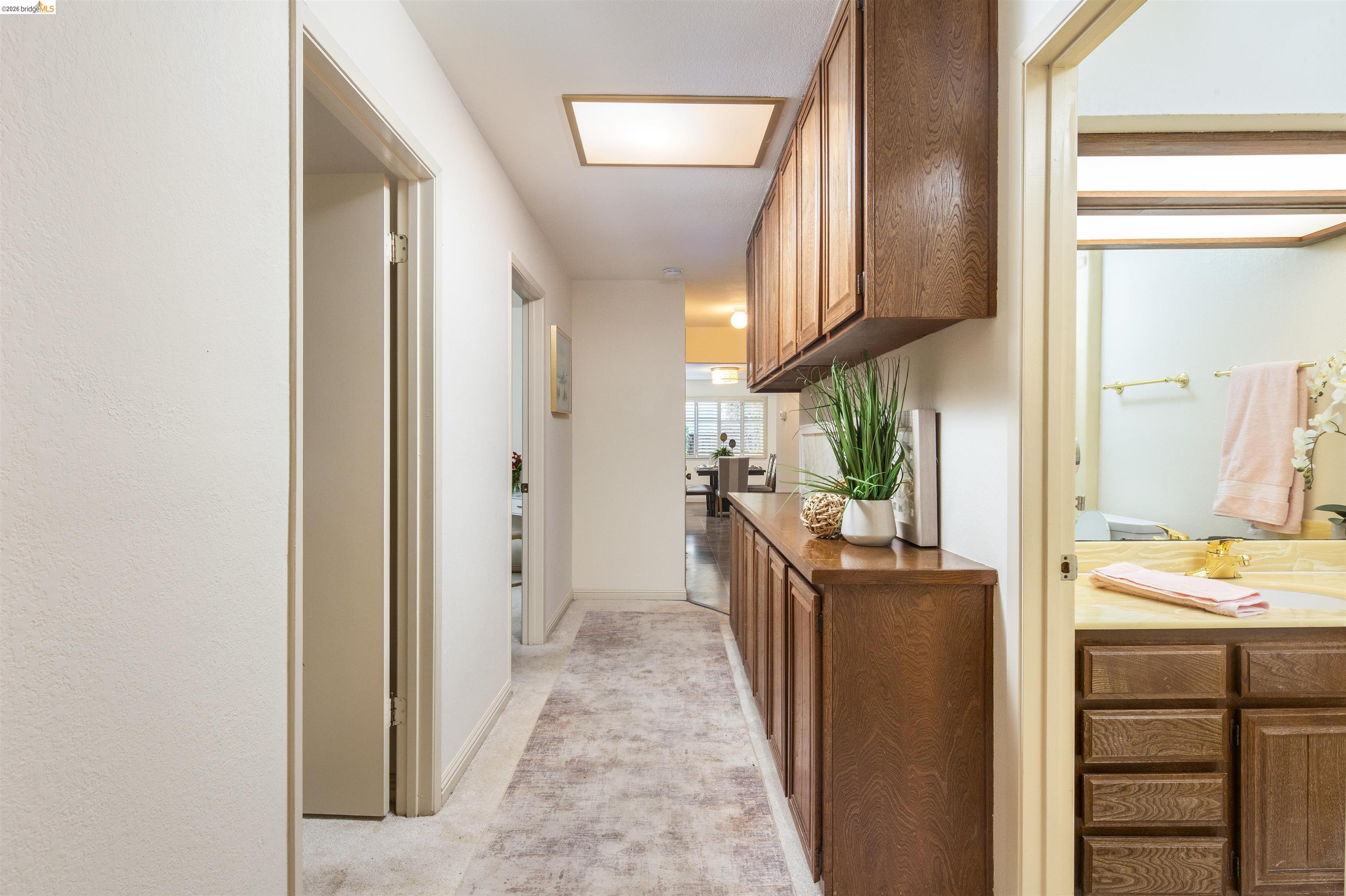3237 Veracruz Drive San Ramon, CA 94583 - Photo 32 of 59 a view of a hallway with wooden floor and staircase