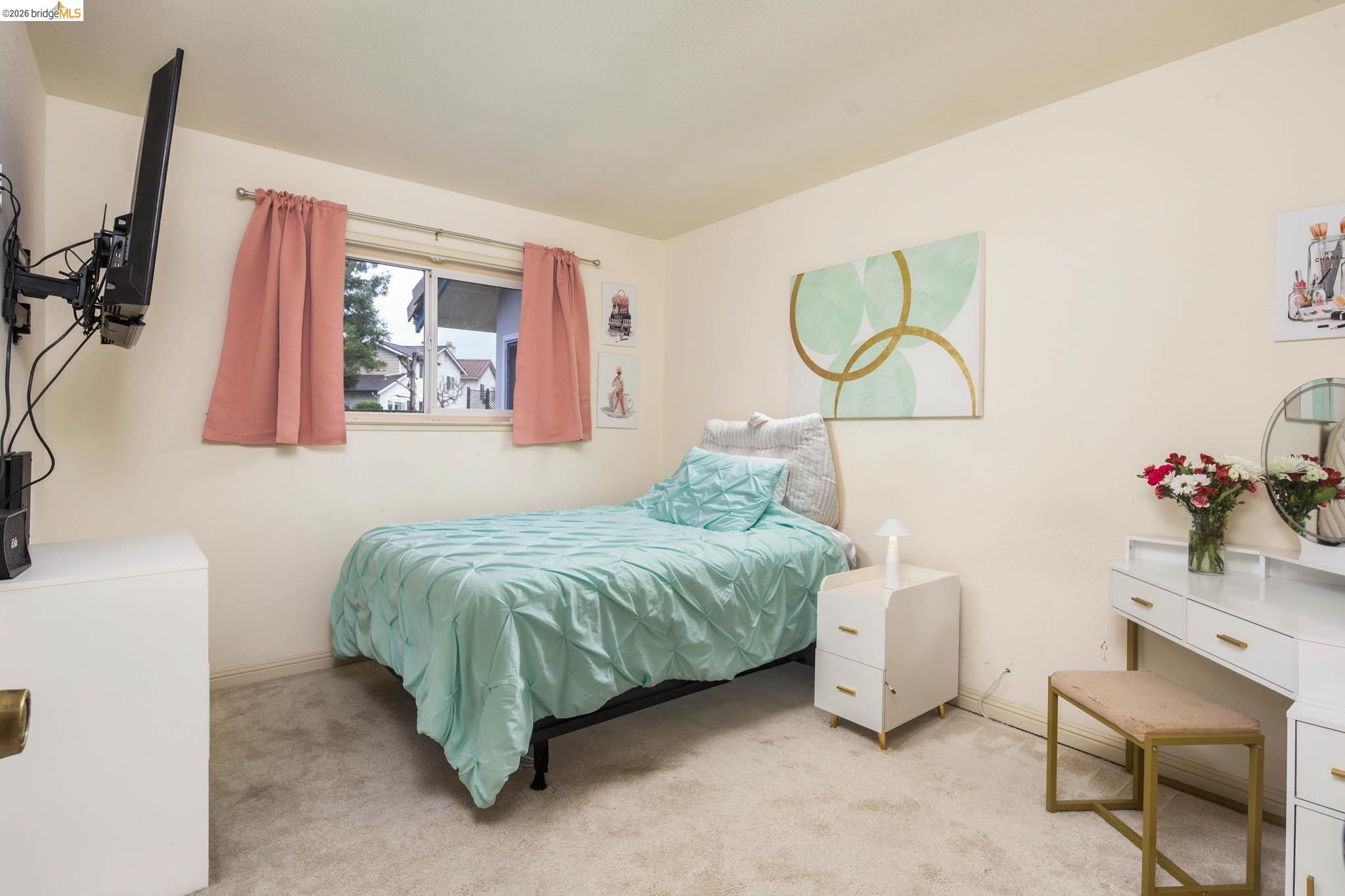 3237 Veracruz Drive San Ramon, CA 94583 - Photo 33 of 59 a bedroom with a bed and a flat tv screen on the dresser