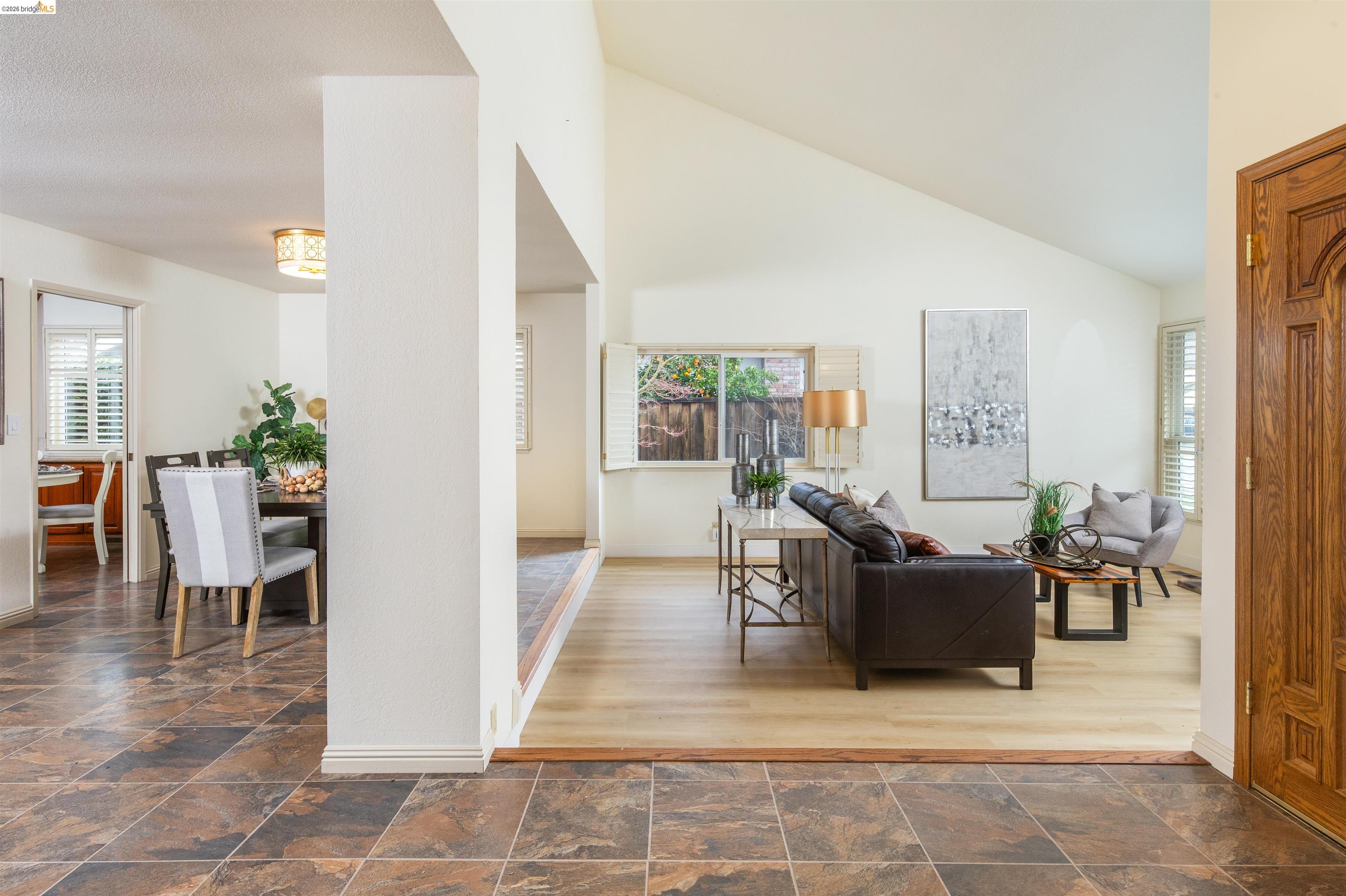 3237 Veracruz Drive San Ramon, CA 94583 - Photo 8 of 59 a living room with furniture a dining table and a potted plant