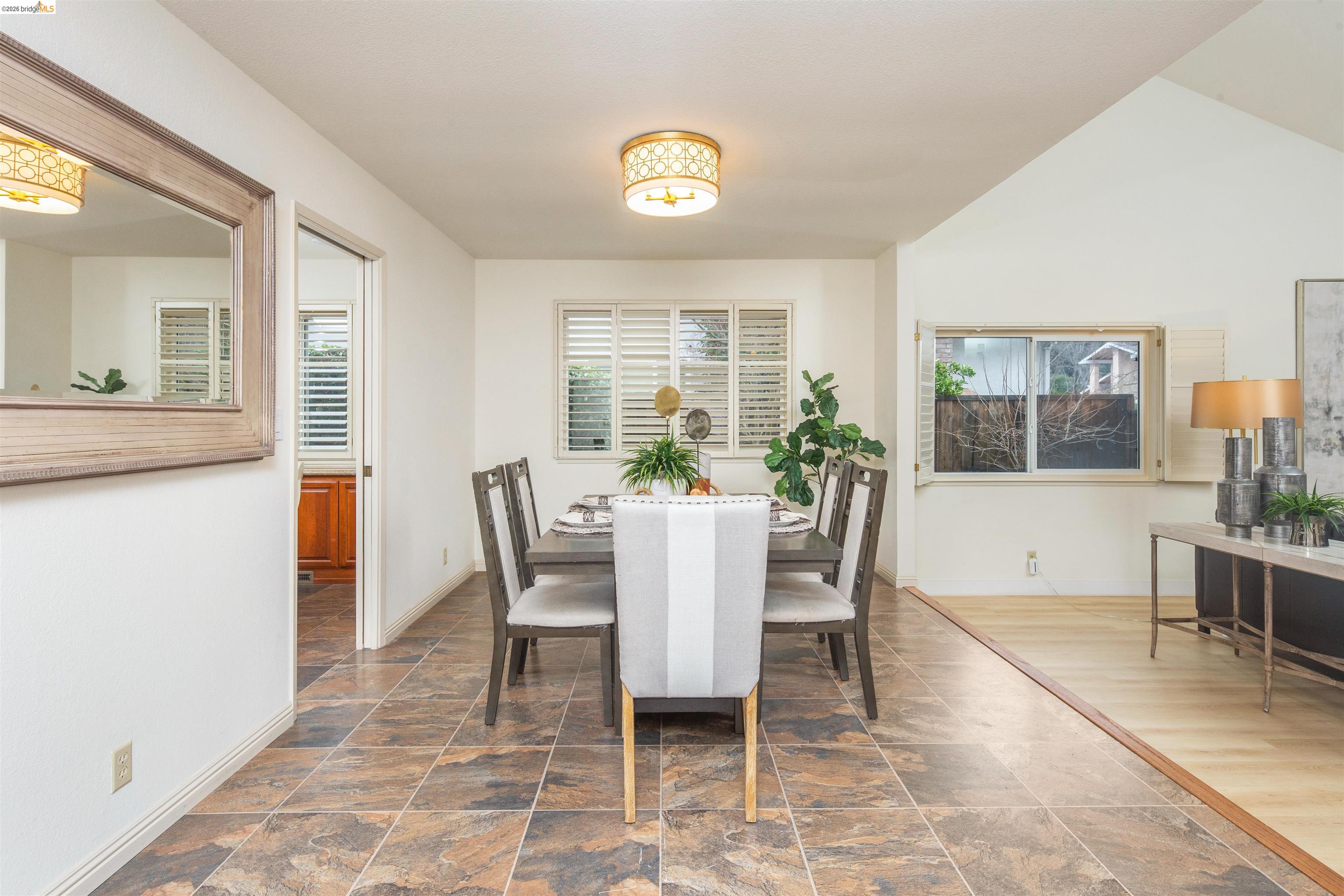 3237 Veracruz Drive San Ramon, CA 94583 - Photo 10 of 59 a dining room with furniture a window and wooden floor