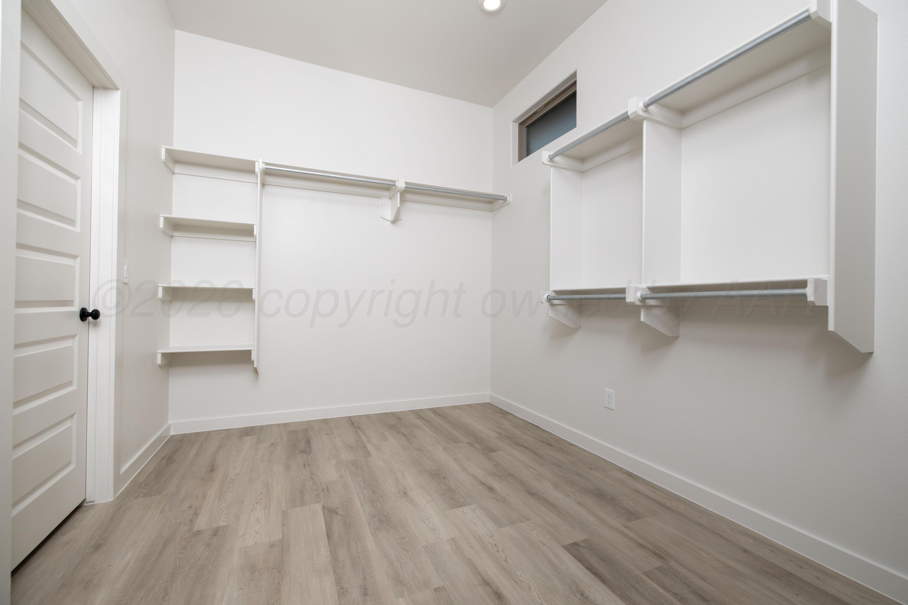 3005 Frontier Lane Amarillo, TX 79124 - Photo 11 of 15 a view of walk in closet with empty racks