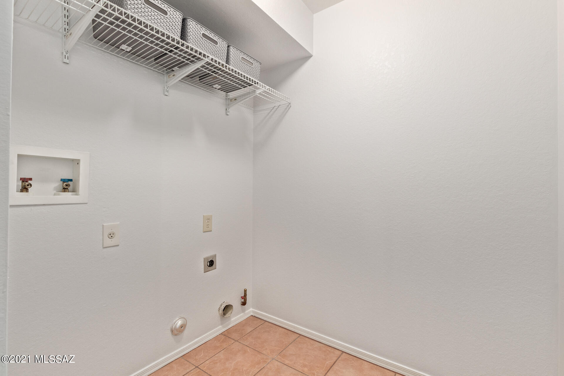 3034 West Sky Ranch Trail Tucson, AZ 85742 - Photo 22 of 27 a view of a room with racks on the wall