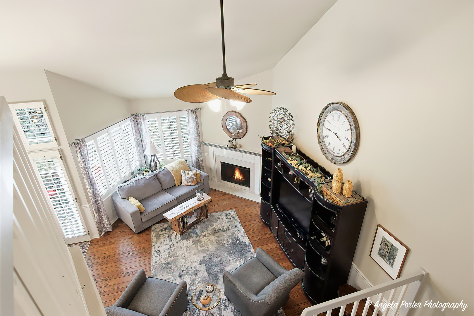 890 Shoreline Road Lake Barrington, IL 60010 - Photo 12 of 42 a living room with furniture a clock and a window