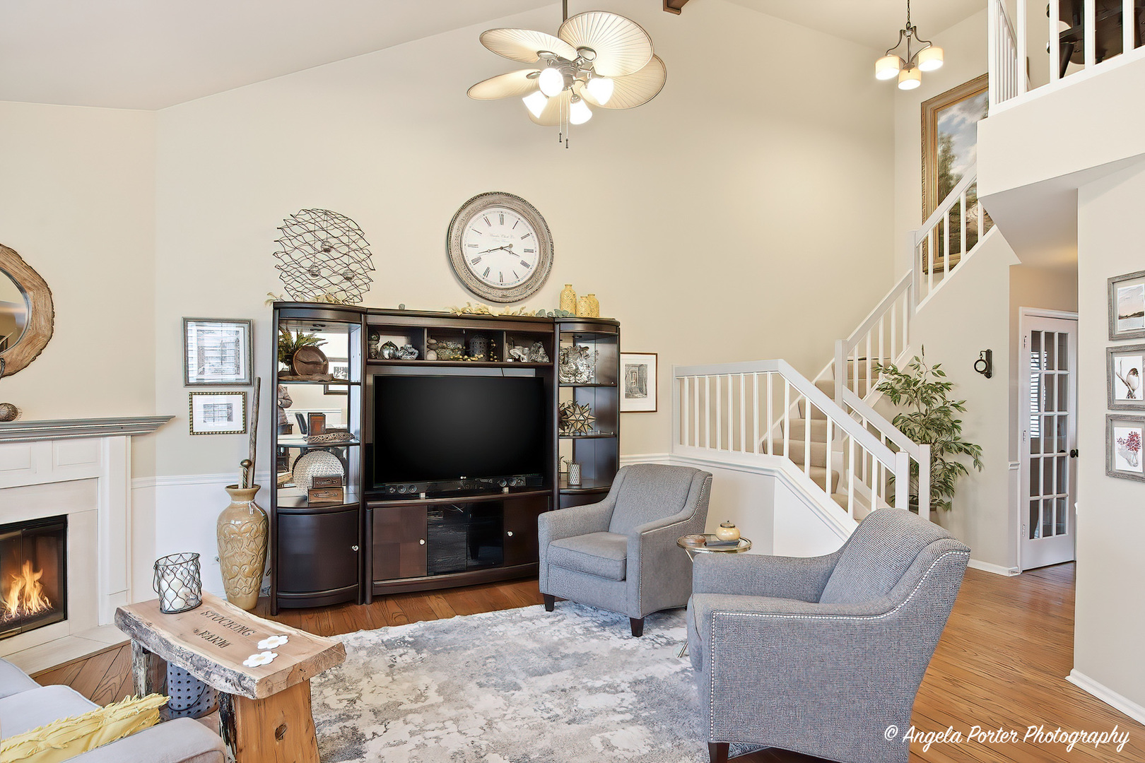 890 Shoreline Road Lake Barrington, IL 60010 - Photo 13 of 42 a living room with furniture a flat screen tv and a fireplace