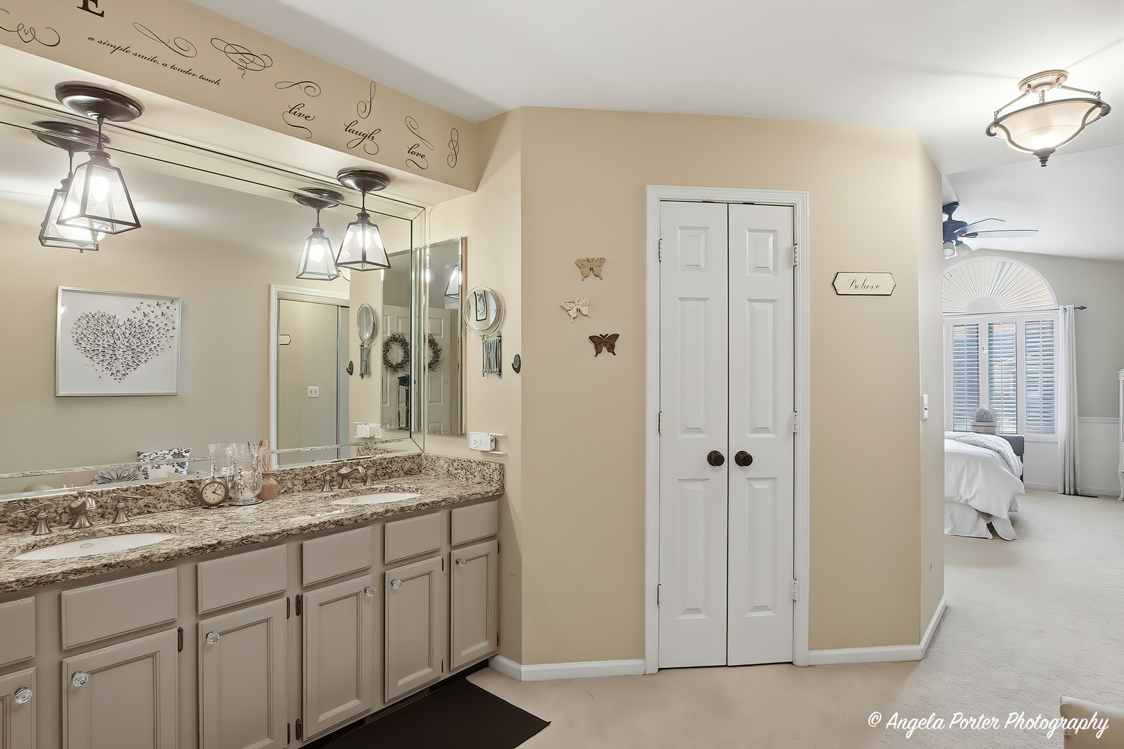 890 Shoreline Road Lake Barrington, IL 60010 - Photo 18 of 42 a bathroom with a granite countertop sink a mirror and a shower