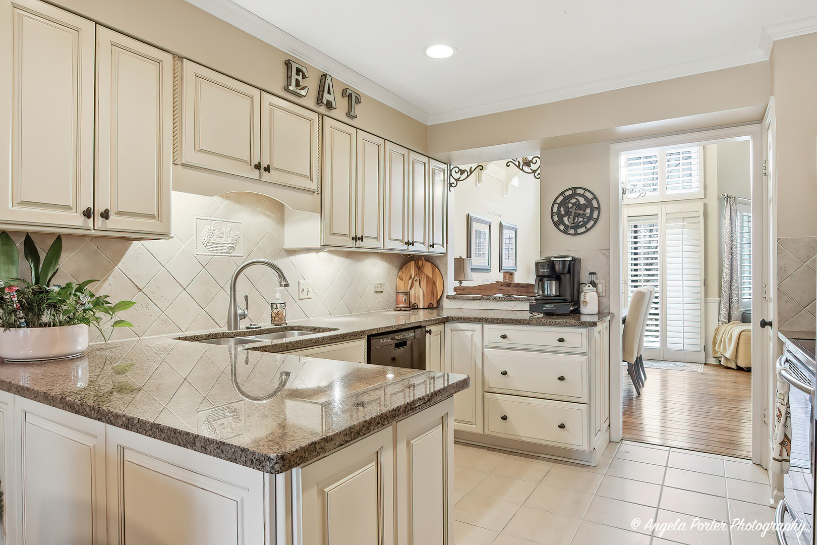890 Shoreline Road Lake Barrington, IL 60010 - Photo 3 of 42 a kitchen with granite countertop a sink a stove and cabinets