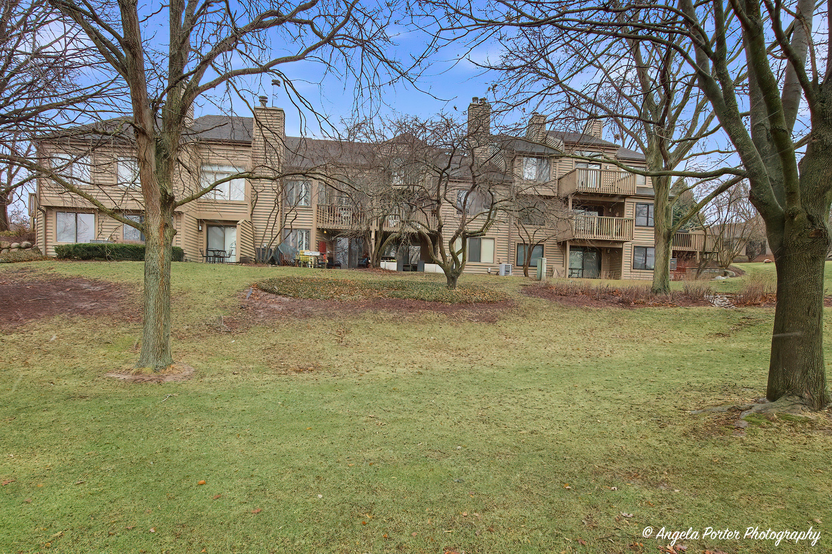 890 Shoreline Road Lake Barrington, IL 60010 - Photo 33 of 42 a view of a building with a yard