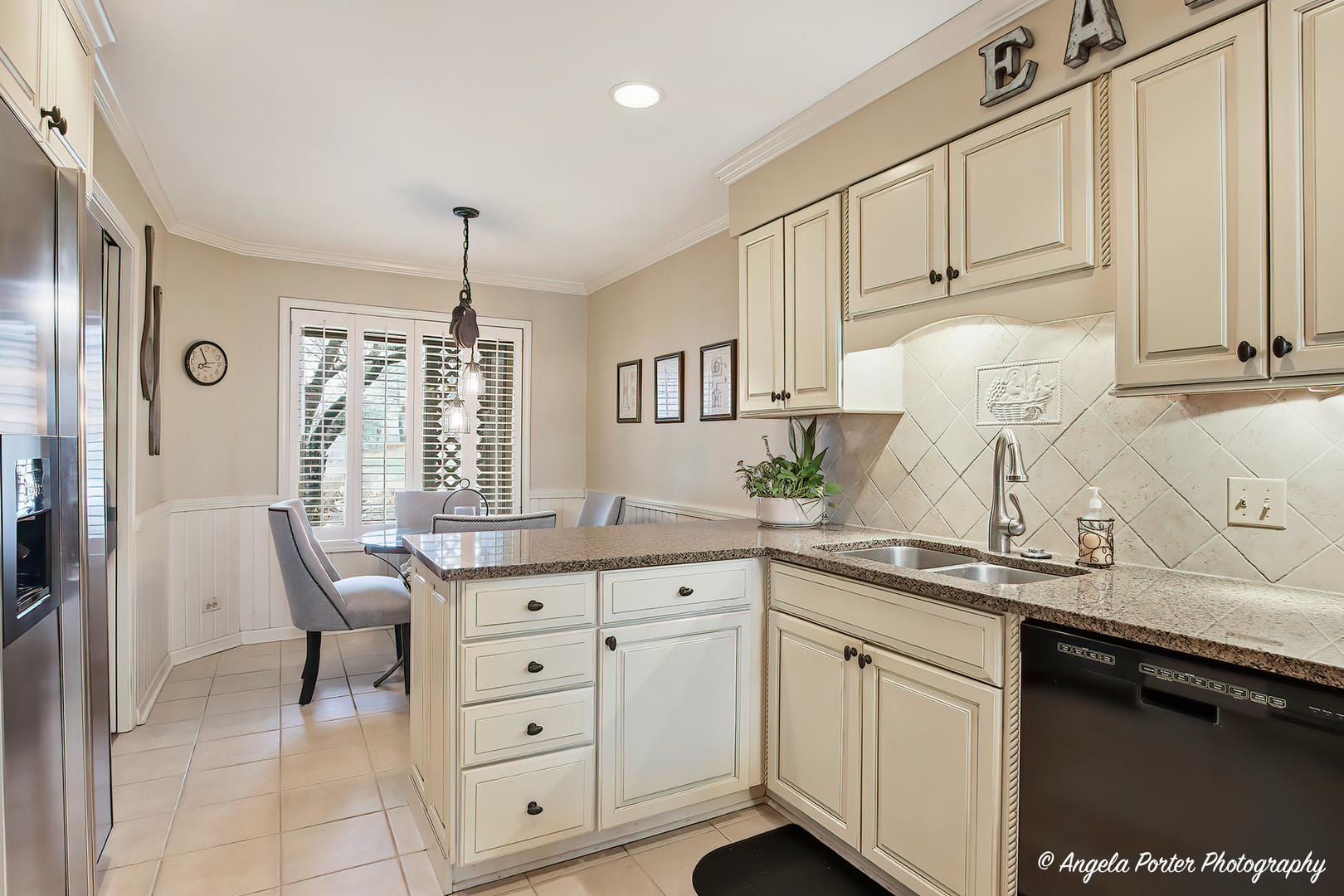 890 Shoreline Road Lake Barrington, IL 60010 - Photo 4 of 42 a kitchen with granite countertop a sink white cabinets and stainless steel appliances